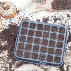 Plastic free rubber seedling tray with 30 cells on a bench with sowing media
