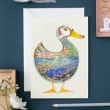 Duck in a pond Greeting Card by The DM Collection showing a print of the original watercolour of a duck filled with a pond designed by Daniel Mackie