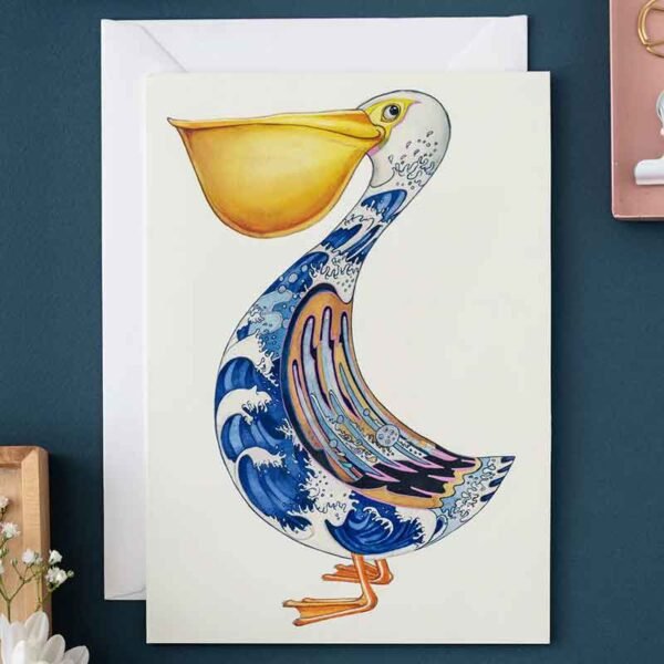 Pelican greeting card illustration by Daniel Mackie on a dark blue background