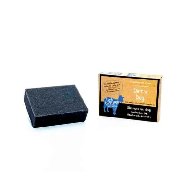 Dark grey Dirty Dog Shampoo Bar next to it's card box on a white background