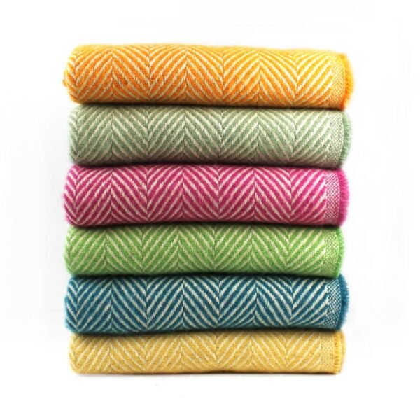 100% wool recycled throw several brightly coloured throws in a pile