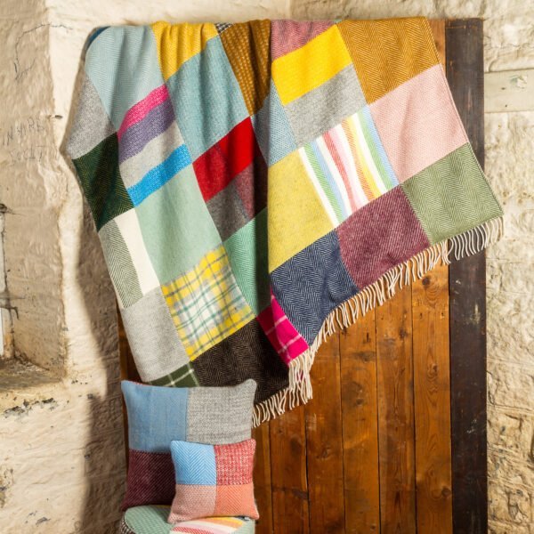 Tweedmill patchwork throw hanging from a door