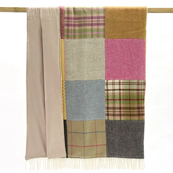 Tweedmill patchwork throw hanging on a rail