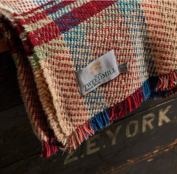 Corner of the recycled Wool Rug by Tweedmill with the Tweedmill label showing as a close up