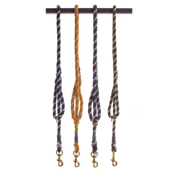 4 x Tweedmill wool rope dog lead hanging in half over a pole on a white background including Navy blue, Mustard Yellow, Charcoal grey and Olive green, all have a silver grey strand running through