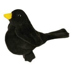 Blackbird finger puppet in black plush with bright yellow bill on a white background