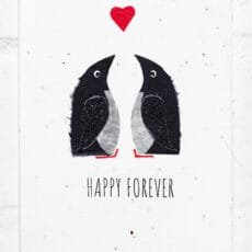 Two penguins below a heart with the text Happy Forever at the bottom on a textured plantable greeting card