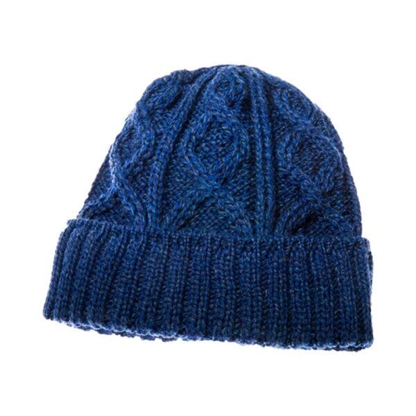 Merino wool hat in Aran knit navy blue on a white background