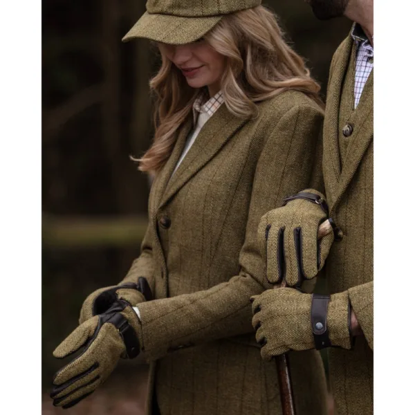 Woman and man wearing light sage brookmore tweed gloves