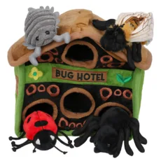 The Bug Hotel Hide Away Puppet showing green and brown bug hotel, 4 finger puppets sitting outside of the hotel of grey woodlouse, red mason bee, 7 spot ladybird and black female ladybird spider on a white background